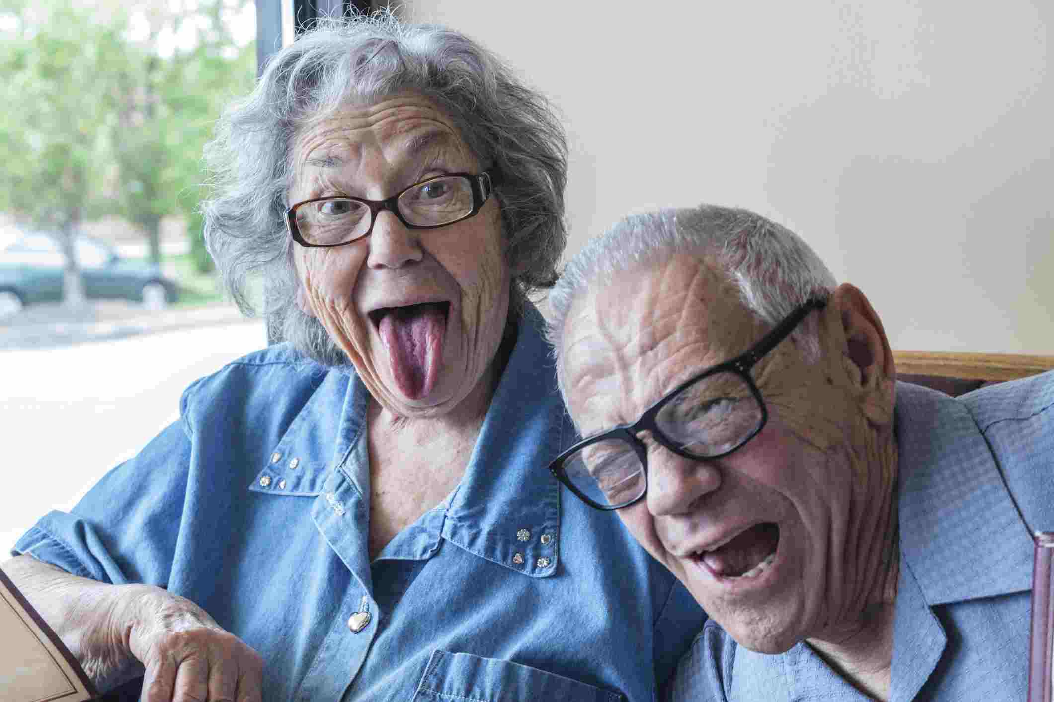 Grandpa Photo Bombing Grandma’s Funny Tongue Wagging Face.